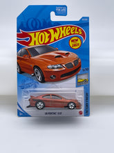 Load image into Gallery viewer, Hot Wheels ‘06 Pontiac GTO (Orange)
